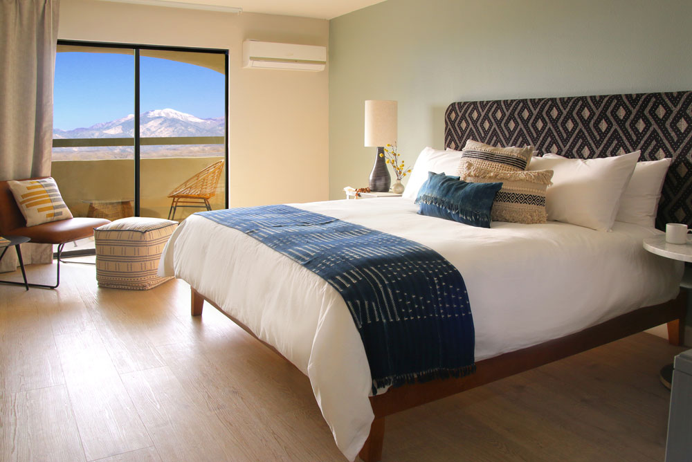 western views of city lights framed by snow-capped Mt. San Gorgonio from your private balcony