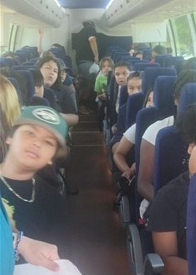Children on bus ride to the Disney Center