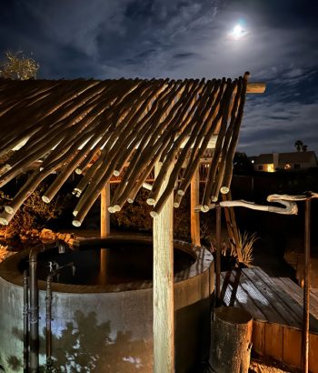 Tub and palapa illuminated by the moonlight