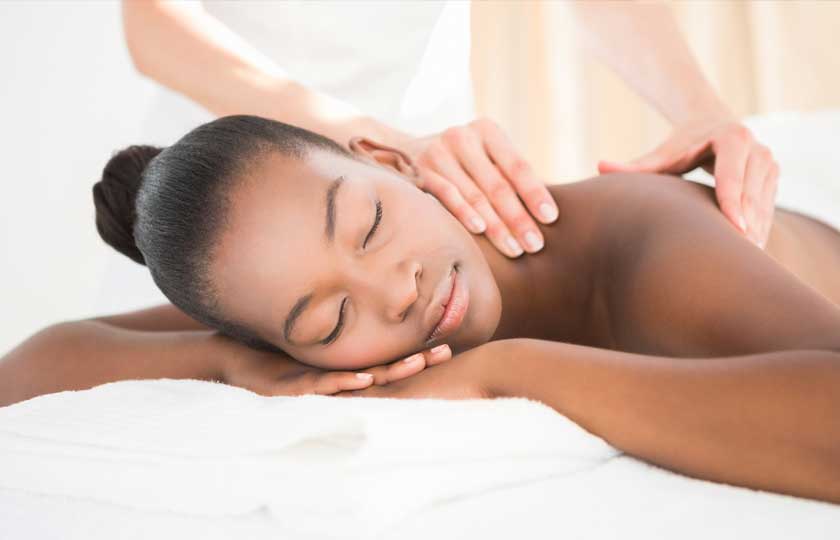 Spa, African-American Woman receiving a massage.