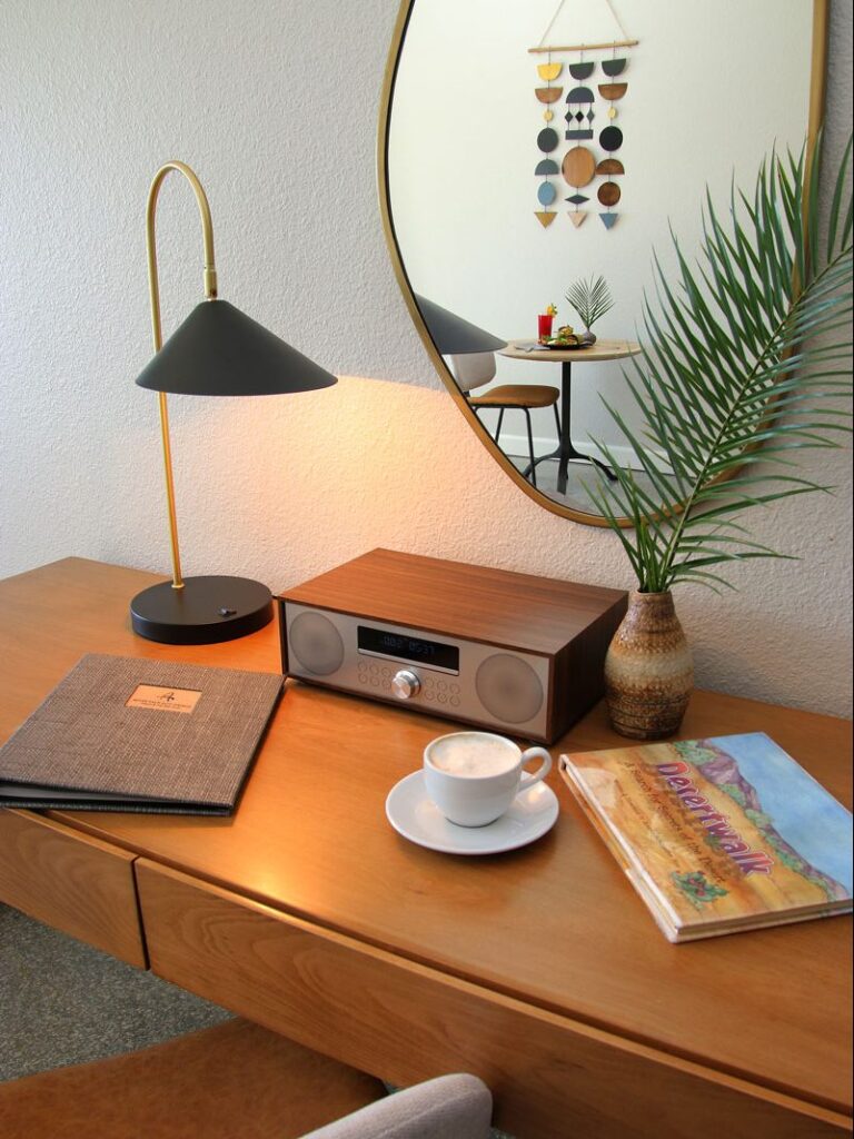Desk with music and desk lamp in a guest room
