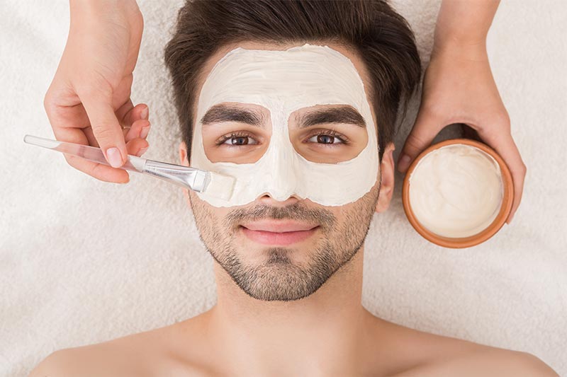 Caucasian Man with facial hair, receiving a Facial Treatment, Spa
