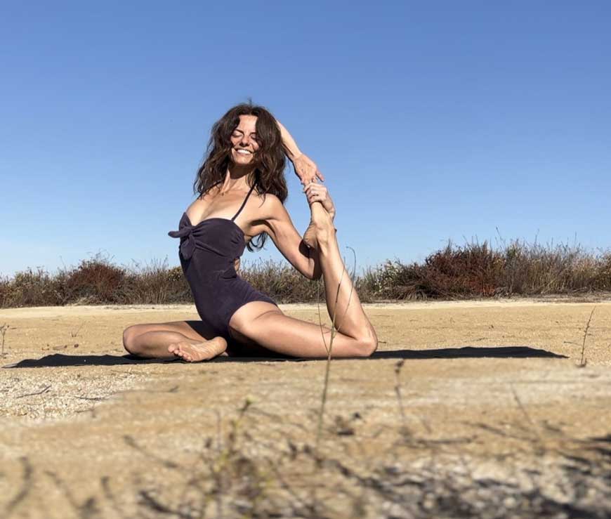 Woman in a Yoga pose in the desert