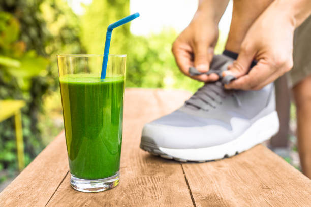 Green Juice, A person tying their athletic shoe preparing for exercise